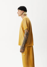 Afends Unlimited - Boxy Logo T-Shirt - Worn Mustard - Afends unlimited   boxy logo t shirt   worn mustard   streetwear   sustainable fashion